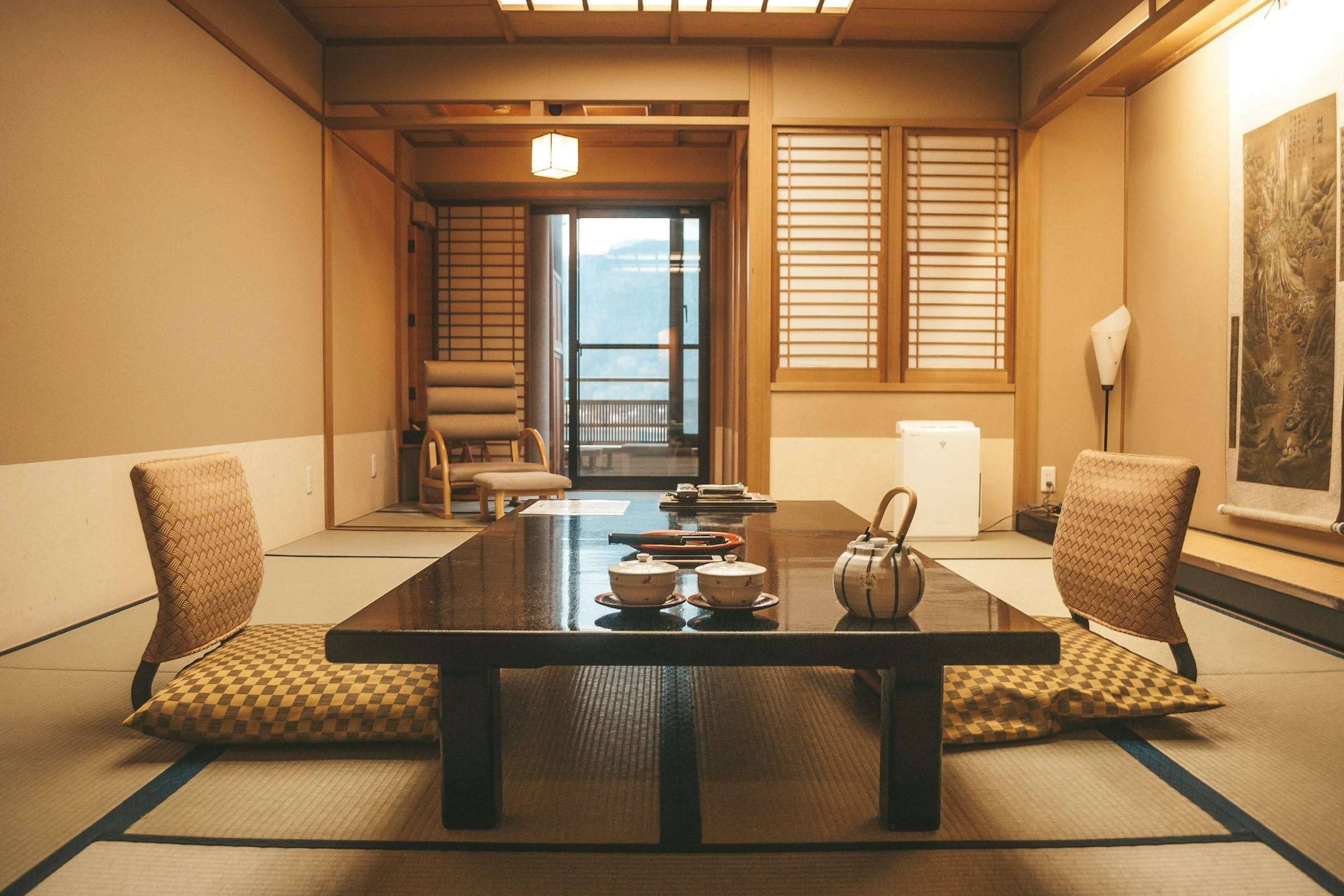 A tatami room with a low lacquered table set for tea